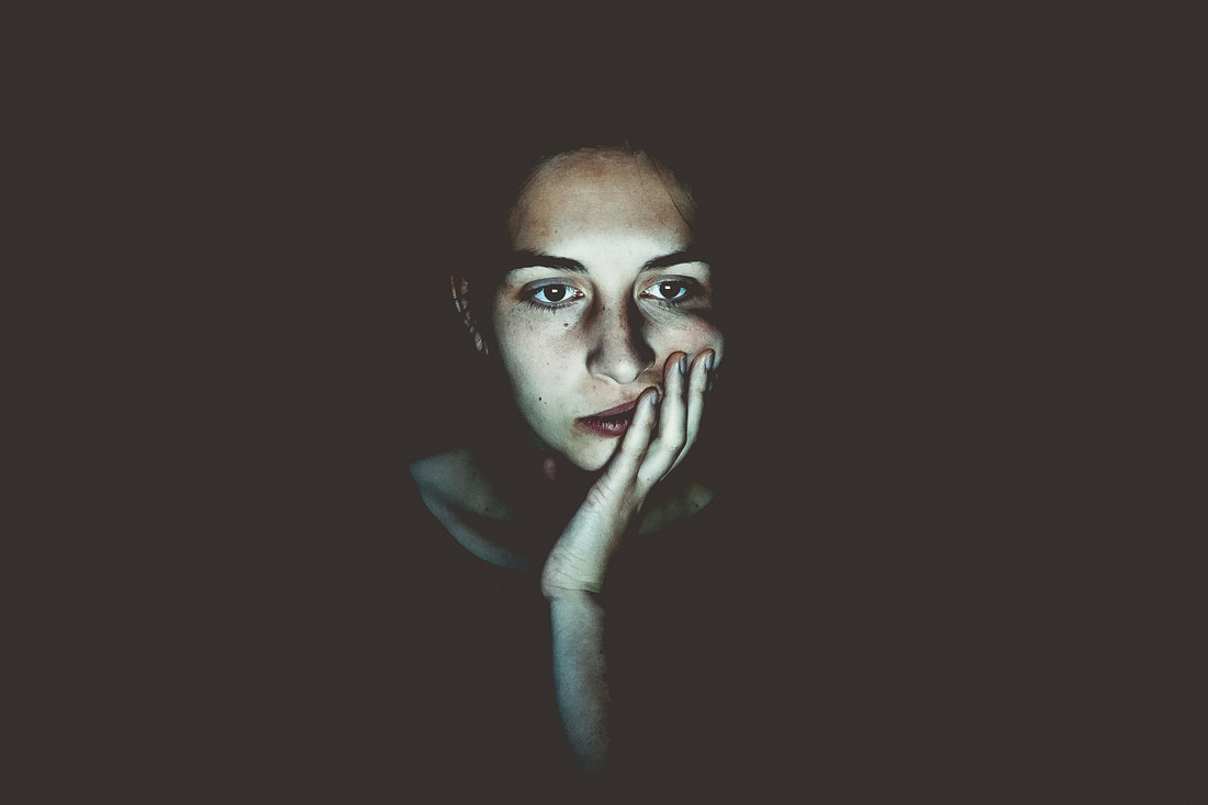 Image of a girl’s face lit up by a computer screen at night for article by Larry G. Maguire