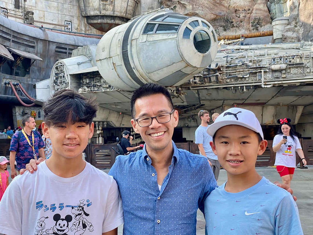 Jeff with his nephews in front of some Star Wars spaceship at Disneyland