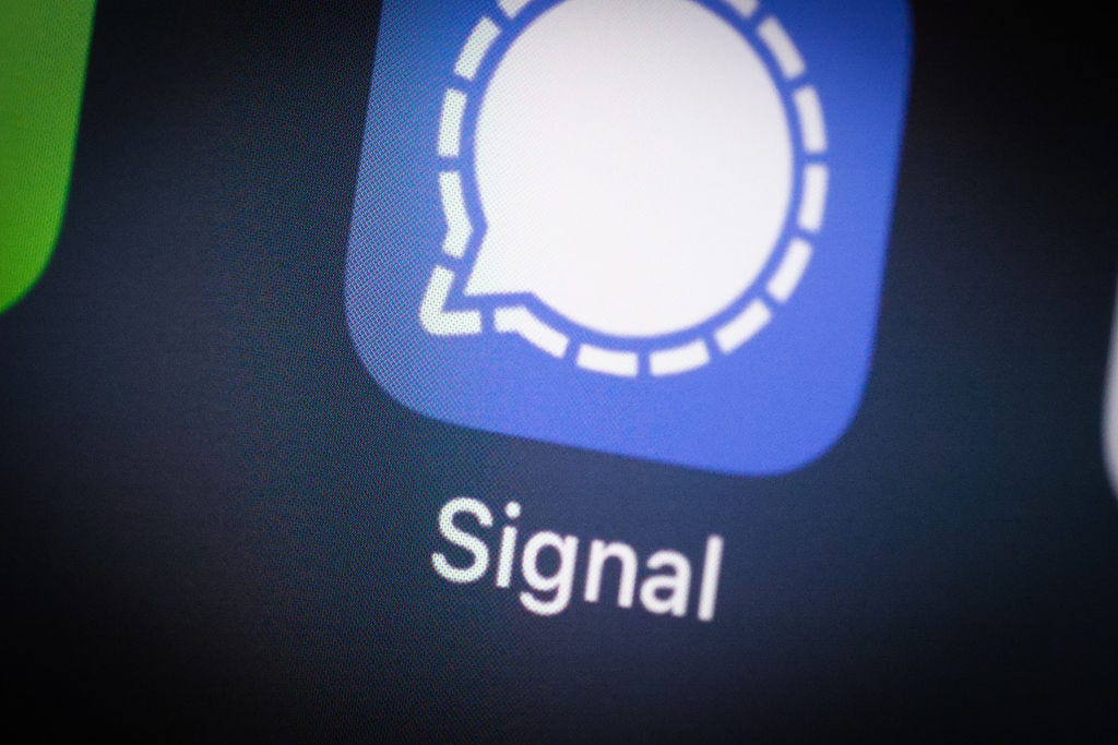 The Signal app icon shown on a phone. (Jaap Arriens / Getty Images)