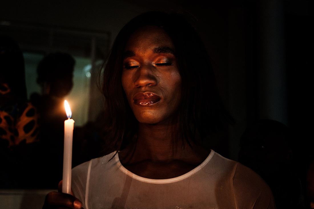 Someone holds a candle during the vigil of Transgender Day of Remembrance in Kampala Uganda.