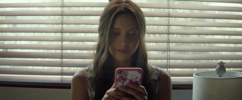 Ingrid (Aubrey Plaza) taps on her iphone. Ennui. [gif]