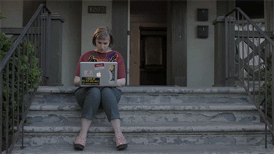 Hanna Horvath from Girls types on her laptop and hits "send" [gif]