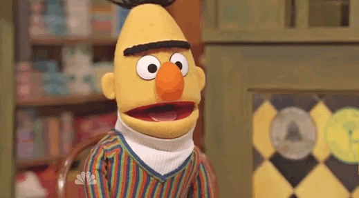 bert from sesame street saying hi with his eyebrows