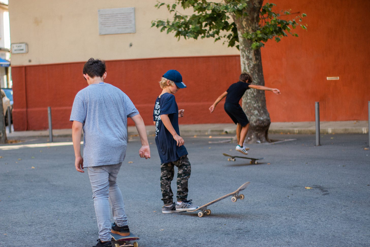 3 boys board skating in Nice: A photo by David Elikwu