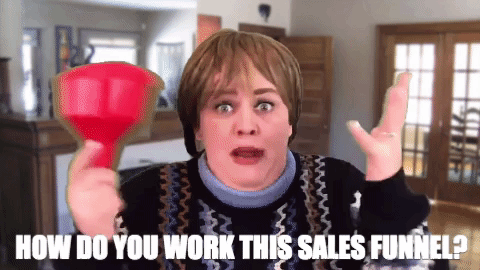 Lady holding a funnel with the caption 'how do you work this sales funnel?'