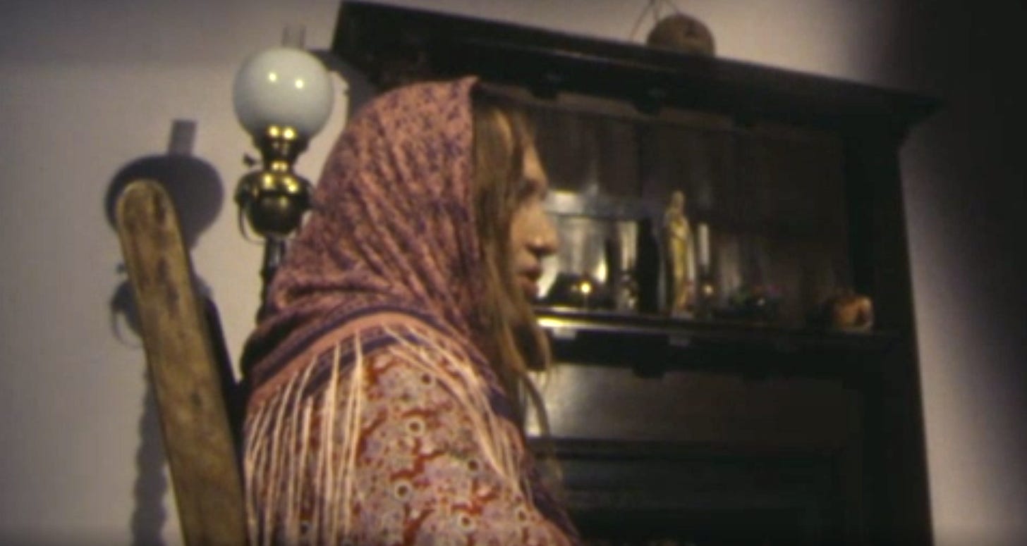 Still from an Irish television program showing a woman in traditional garb viewed from the side so her full face is not visible. Still from an Irish television program showing a woman in traditional garb viewed from the side so her full face is not visible.