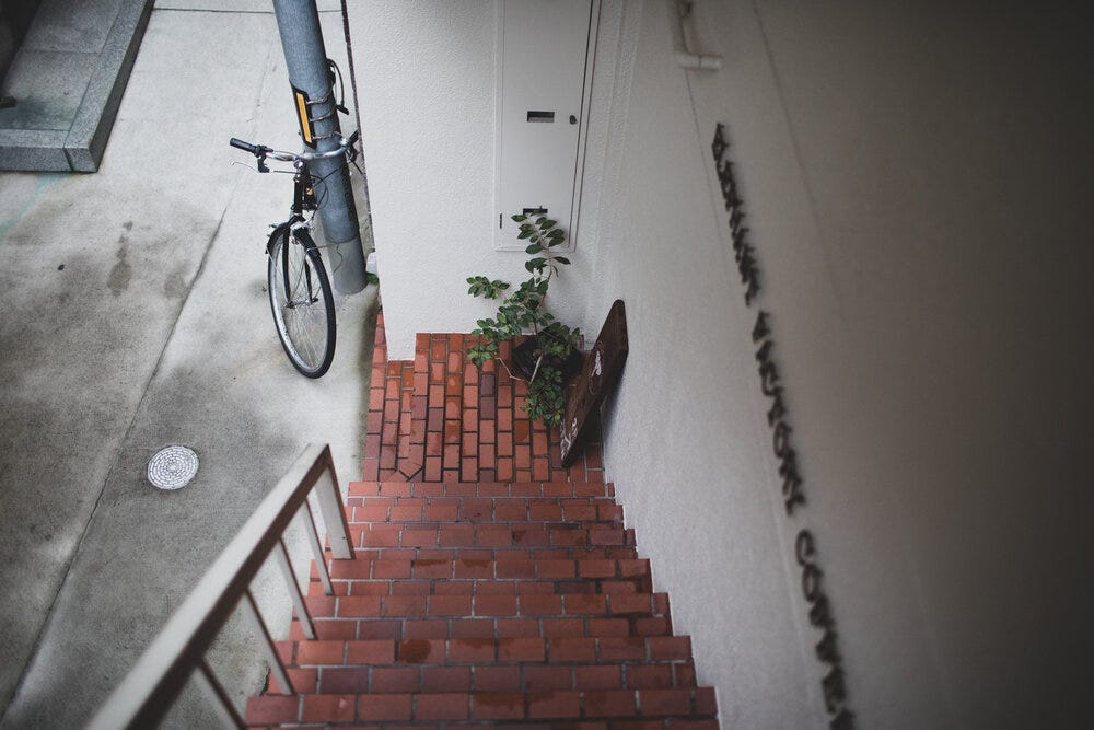 The stairs leading up to the unsigned, nondescript front door of Elephant Factory. The stairs leading up to the unsigned, nondescript front door of Elephant Factory.