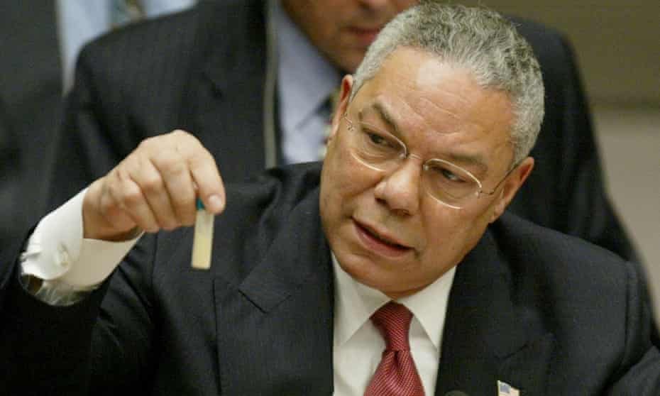 Colin Powell holds up a vial during his presentation to the UN security council in New York on 5 February 2003. 