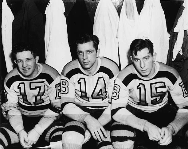 Canadian professional hockey players and childhood friends Bobby Bauer , Woody Dumart , and Milt Schmidt of the Boston Bruins' legendary 'Kraut Line'...