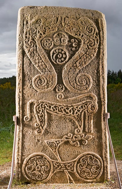 Reverse face of Rodney's Stone with Pictish symbols carved in high relief: a pair of hippocamps (not usually classed as part of the Pictish symbol canon), a “Pictish beast”, and a double-disc and Z-rod.