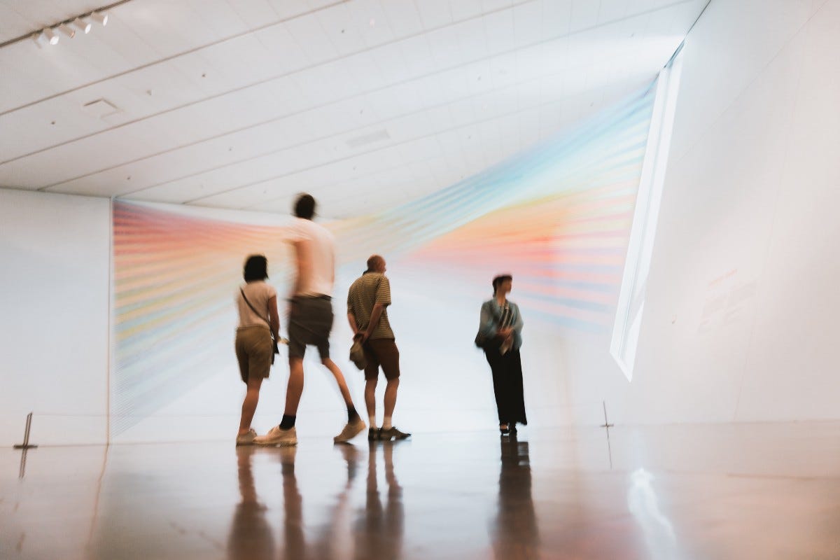 People watching art in a museum
