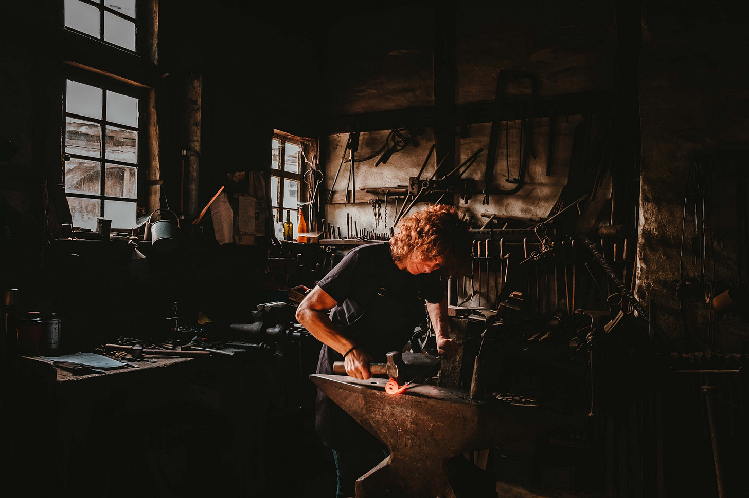 image of a blacksmith working in a workshop for article by Larry G. Maguire image of a blacksmith working in a workshop for article by Larry G. Maguire