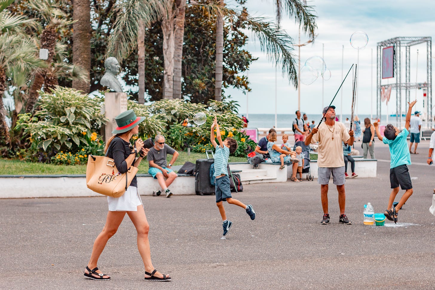 People strolling, resting and kids playing at the park in Nice: A photo by David Elikwu 
