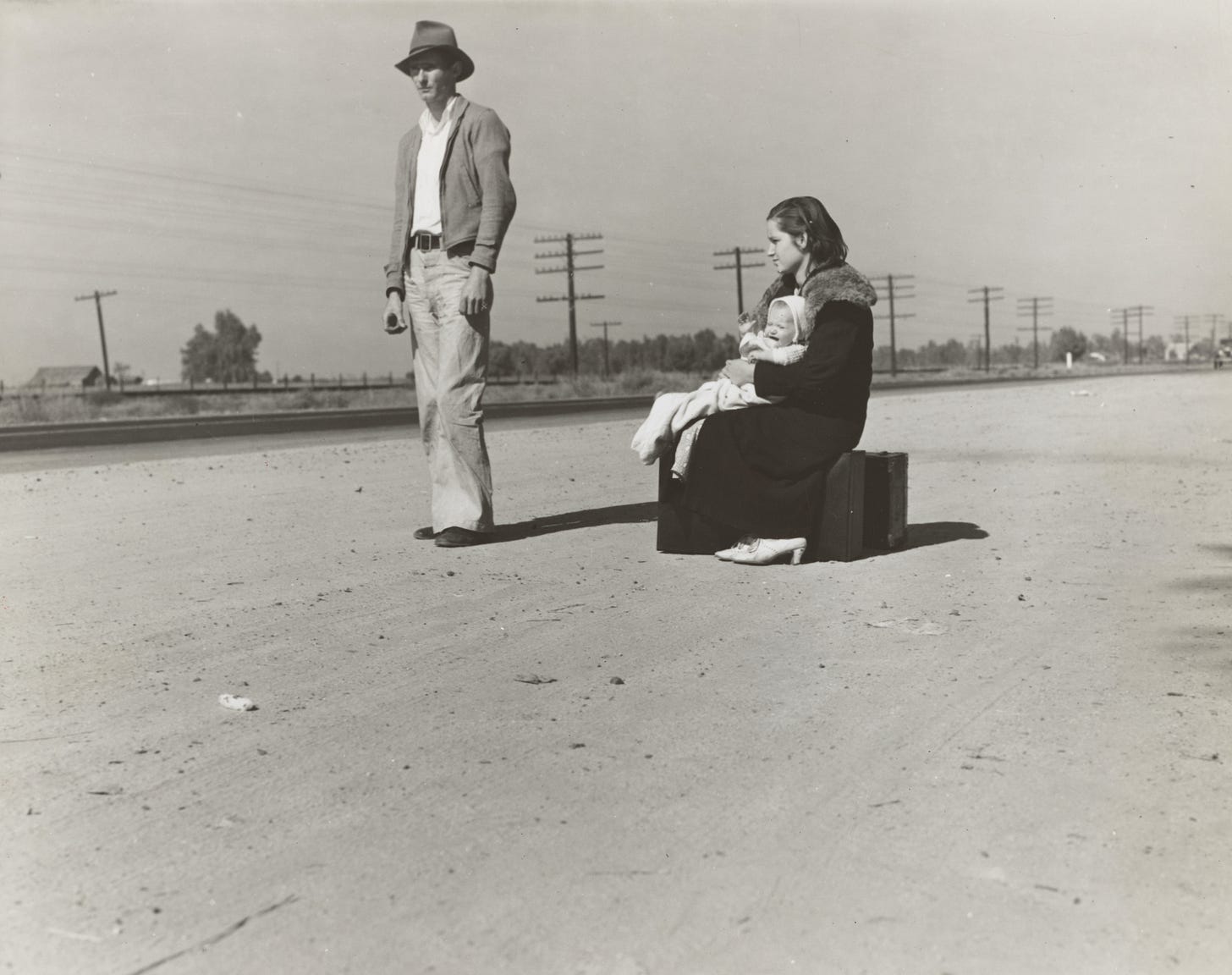 Young family, penniless, hitchhiking on U.S. Highway 99, California. The father, twenty-four, and the mother, seventeen, came from Winston-Salem, North Carolina, early in 1935 Photographer Dorothea Lange Young family, penniless, hitchhiking on U.S. Highway 99, California. The father, twenty-four, and the mother, seventeen, came from Winston-Salem, North Carolina, early in 1935 Photographer Dorothea Lange