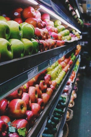 Image of a supermarket aisle of apples on article by Larry G. Maguire Image of a supermarket aisle of apples on article by Larry G. Maguire