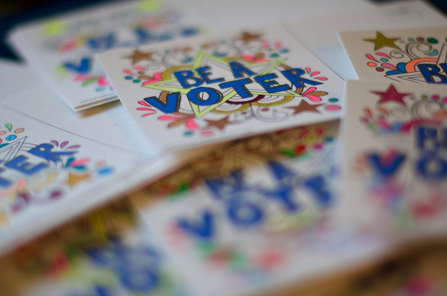 Pile of "Be a Voter" stickers Pile of "Be a Voter" stickers