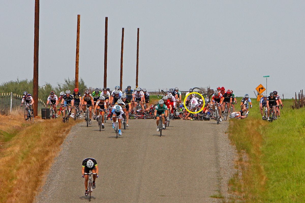 Photo of a bike race crash. Ken Norton is circled.