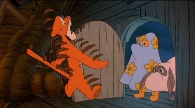 screenshot of frightened Tigger opening the door to see Pooh dressed as a ghost screenshot of frightened Tigger opening the door to see Pooh dressed as a ghost