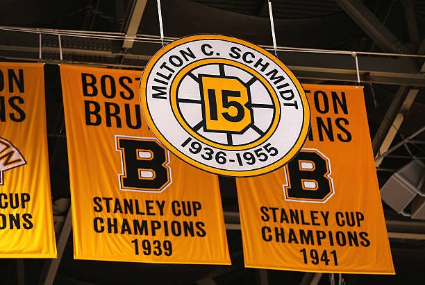 The number 15 of Bruins legend Milt Schmidt is lowered over the TD Garden in Boston on Jan. 5, 2016 in honor of Schmidt, who died the previous day....