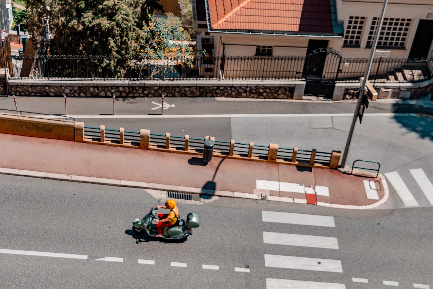 A man riding on a scooter in Monaco: A photo by David Elikwu