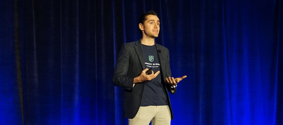 Young man speaking on stage