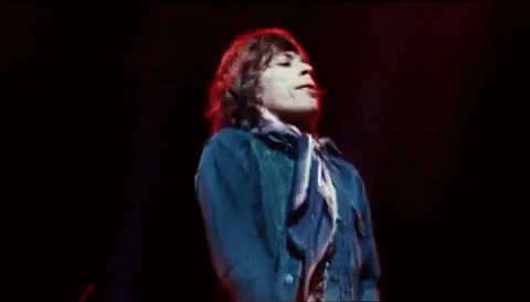 Mick Jagger dances to what I suppose is "gimme shelter" [gif]