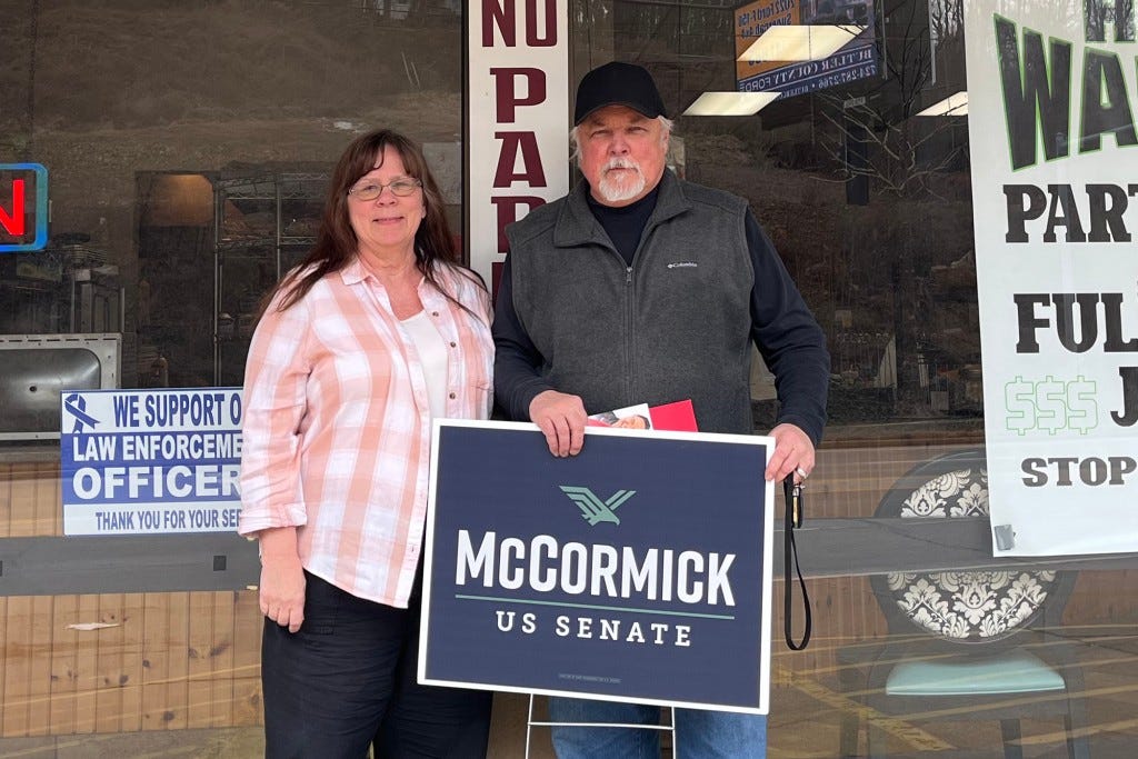 “He is a warrior, a happy warrior, despite everything that is going on in the world,” said Ed Nesbel (pictured with wife Deborah Young) about McCormick after attending the candidate’s event in Butler, Penn.