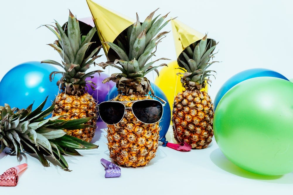 several pineapples at a party several pineapples at a party