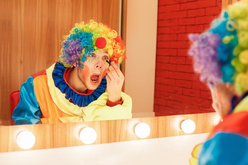 Clown Does A Makeup In Front Of The Mirror Stock Photo - Download Image Now  - iStock