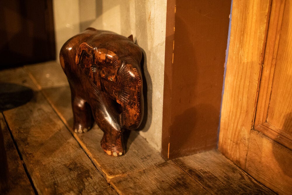 A wooden elephant guards the front door of Elephant Factory. A wooden elephant guards the front door of Elephant Factory.