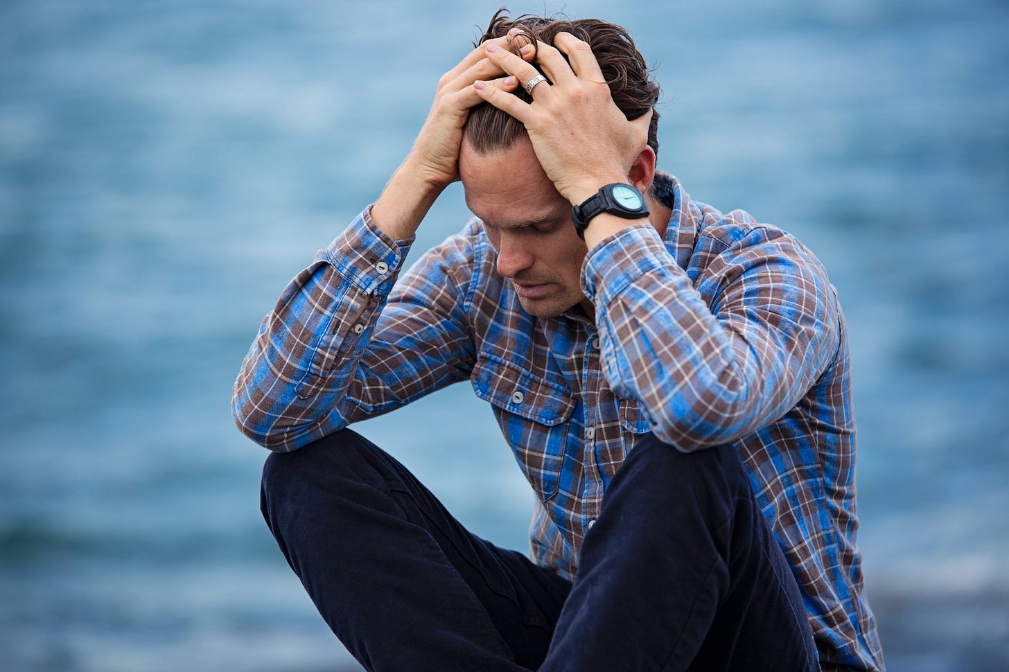 man sitting cross-legged feeling stressed for article by Larry G. Maguire man sitting cross-legged feeling stressed for article by Larry G. Maguire