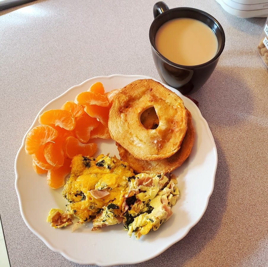 Tea, fritatta, clementine, and toasted bagel