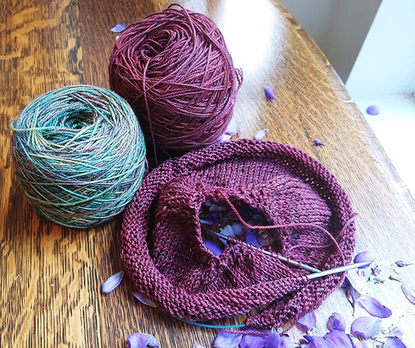 Picture of two balls of yarn and a knitted item. Picture of two balls of yarn and a knitted item.