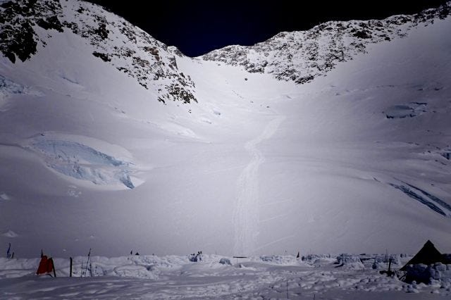 A view of the headwall and fixed lines up to Denali's West Buttress from camp at 14,000 feet