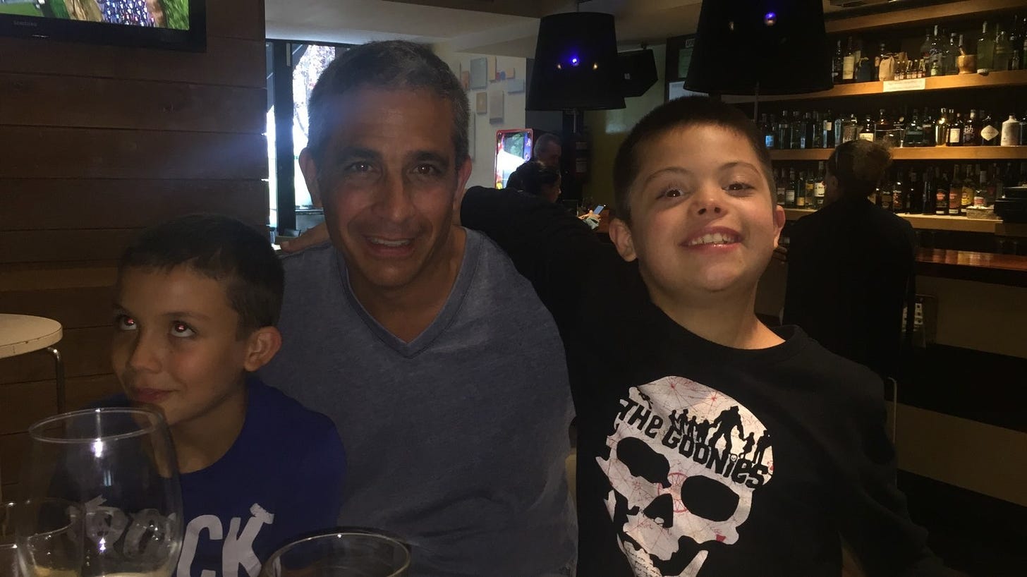 David Mendoza Herrarte with his two sons after being allowed to return to Spain from the US