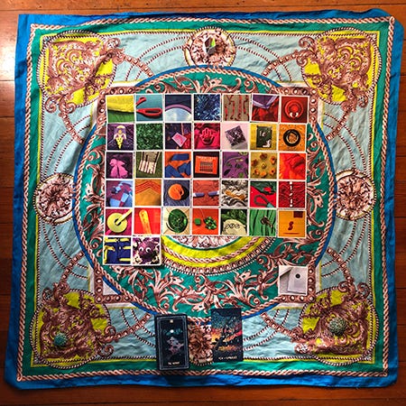 37+ cards laid in a grid on a colorful silk scarf. Rainbow Squared cards with images from Year 2. This is the spread for this week’s reading, piece thirty-seven of Rainbow Squared Year 5. Each card is laid out in the order that I drew them this year. 37+ cards laid in a grid on a colorful silk scarf. Rainbow Squared cards with images from Year 2. This is the spread for this week’s reading, piece thirty-seven of Rainbow Squared Year 5. Each card is laid out in the order that I drew them this year.