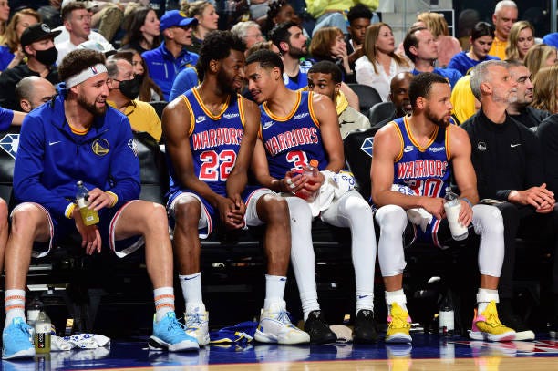Klay Thompson, Andrew Wiggins, Jordan Poole and Stephen Curry of the Golden State Warriors look on during the game against the Milwaukee Bucks on...