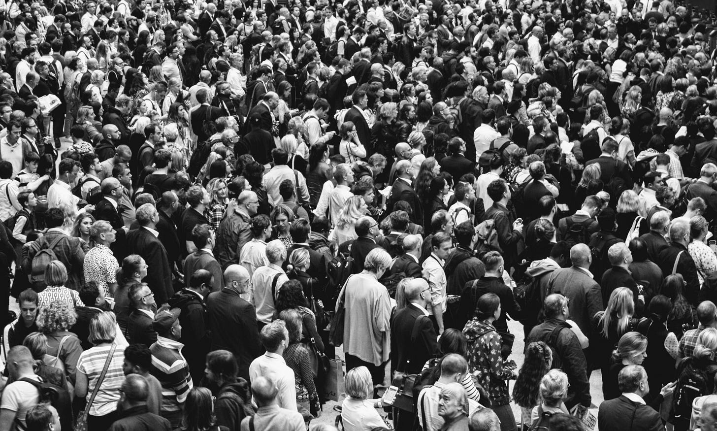 black and white image of a crowd for article by Larry G. Maguire black and white image of a crowd for article by Larry G. Maguire