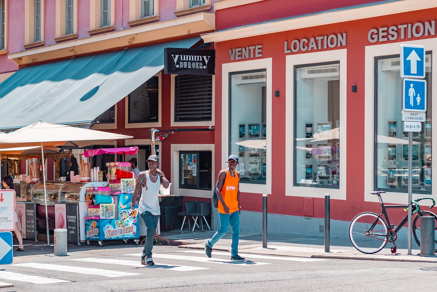 Two men walking on the street in Nice: A photo by David Elikwu