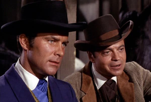 Robert Conrad, left, as James T. West, with Ross Martin as Artemus Gordon in an episode of the TV series “The Wild Wild West” in 1966.
