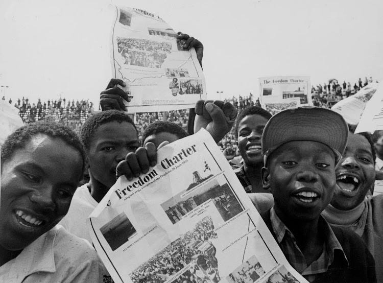 Youths brandish the Freedom Charter in Soweto in 1986. Youths brandish the Freedom Charter in Soweto in 1986.