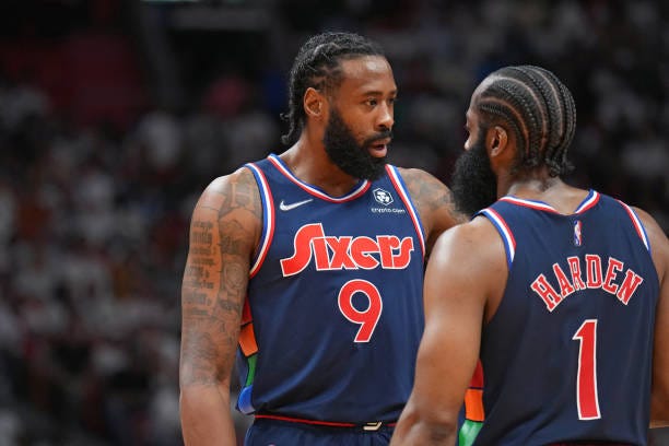 DeAndre Jordan of the Philadelphia 76ers and James Harden of the Philadelphia 76ers talk during a game against the Miami Heat during Game 1 of the...