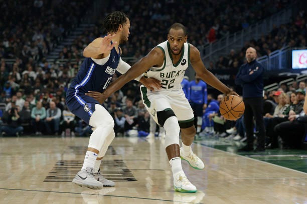 Khris Middleton of the Milwaukee Bucks looks to drive during the first half of the game against the Dallas Mavericks at Fiserv Forum on April 03,...