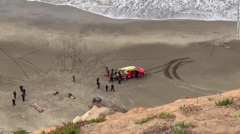 Woman rescued after car plunges off a cliff, landing on a San Francisco beach