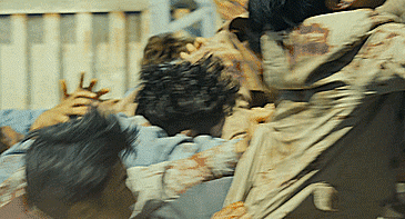 Hundreds of zombies chase and pile onto the back of a moving train, dragging a chain of bodies behind the train. From Train to Busan. [gif]