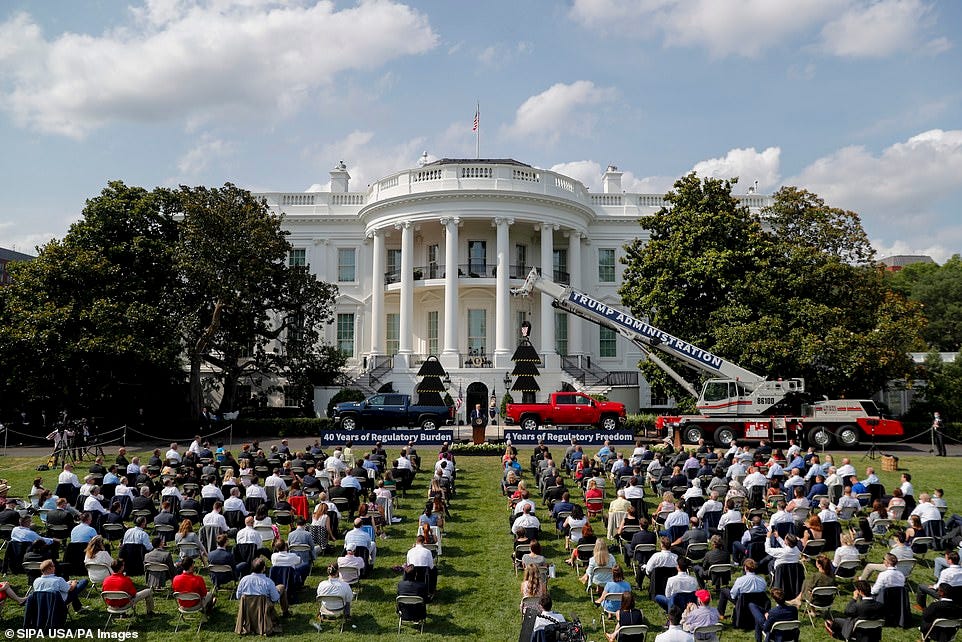 REGULATED: About 200 attendees were seated in rows. There were two large bottles of hand sanitizer and a military band playing 'Georgia' and 'God Bless America' REGULATED: About 200 attendees were seated in rows. There were two large bottles of hand sanitizer and a military band playing 'Georgia' and 'God Bless America'
