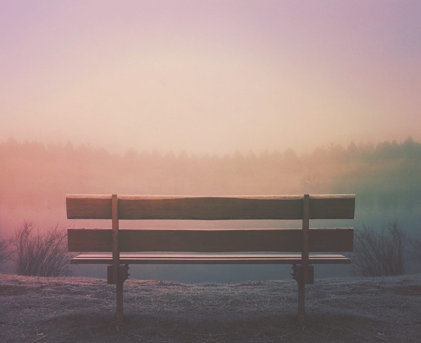 bench in front of sunset