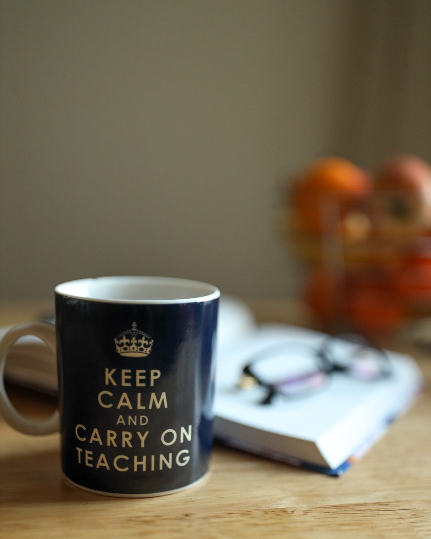 Photo of coffee mug that says keep calm and carry on teaching. Photo of coffee mug that says keep calm and carry on teaching.