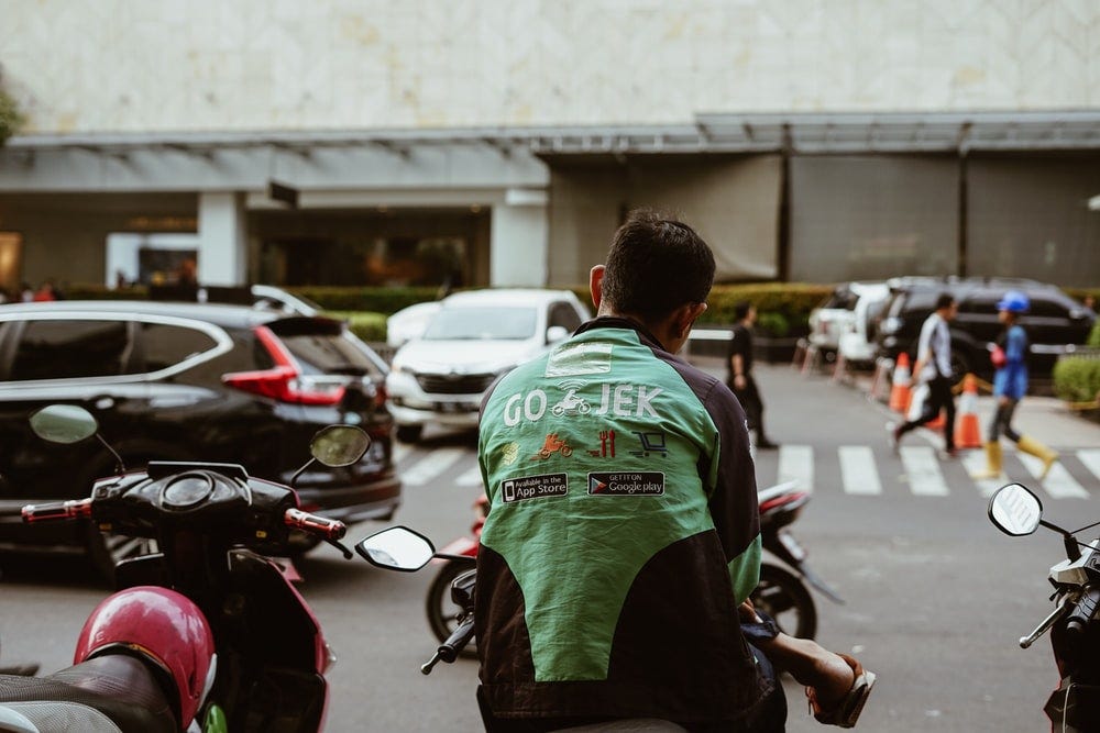 man sitting on motorcycle