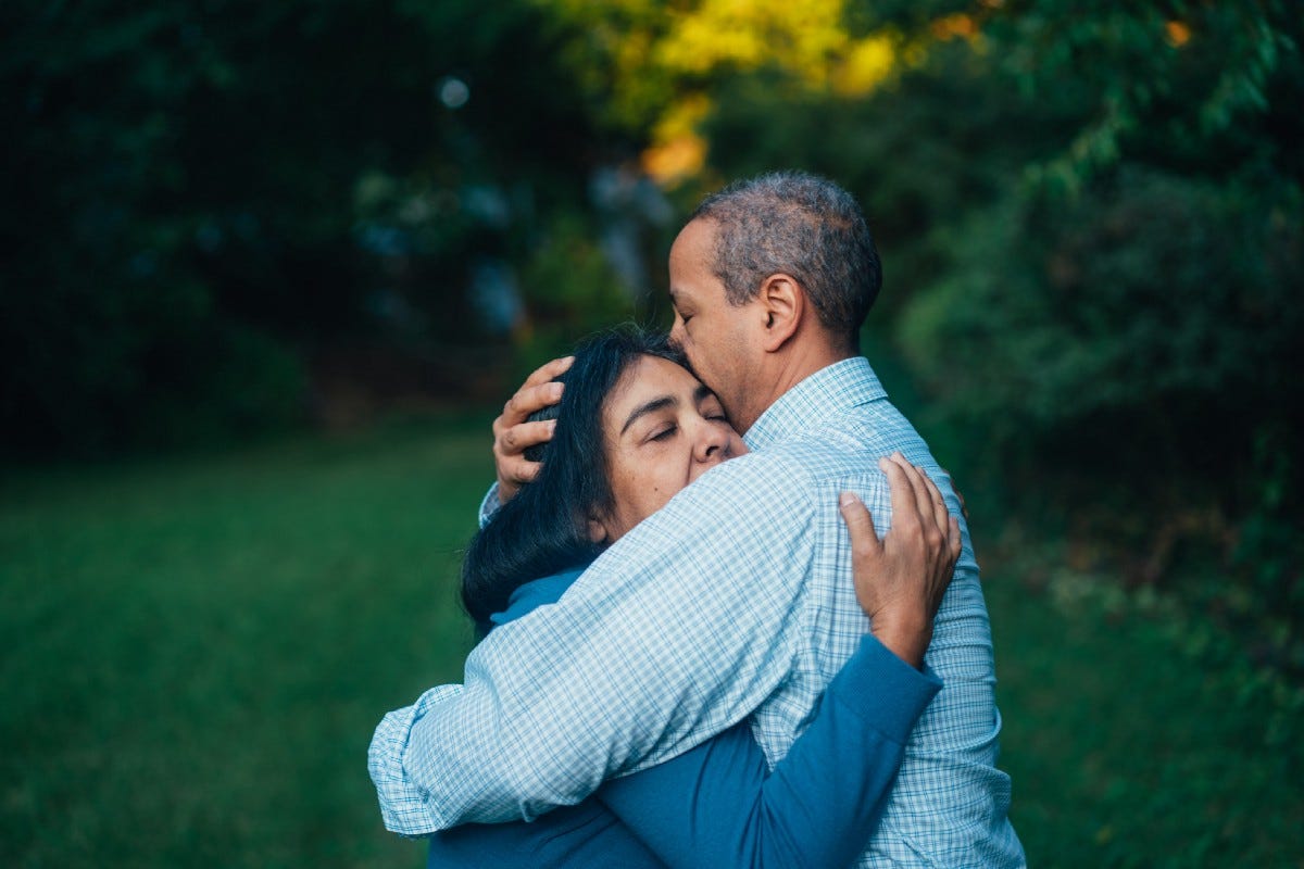 A man and a woman hugging A man and a woman hugging